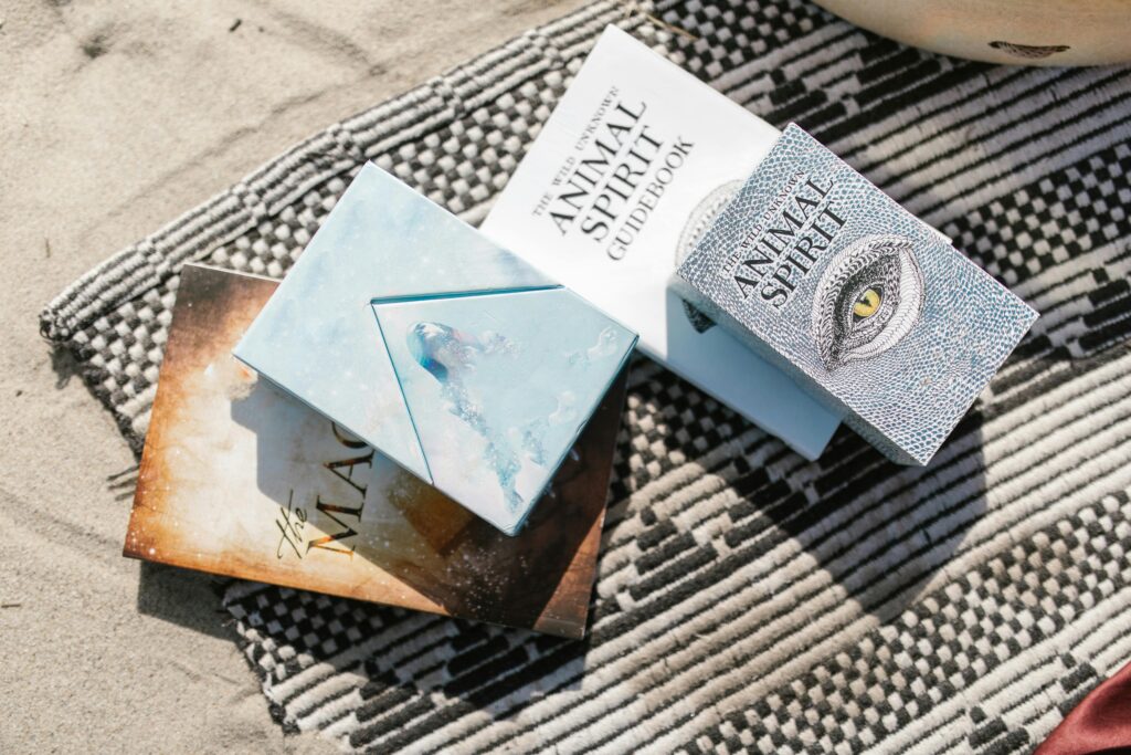 Audacitymagazine.com september horoscope has an image of four books layererd. they are animal spirit books or so the title says