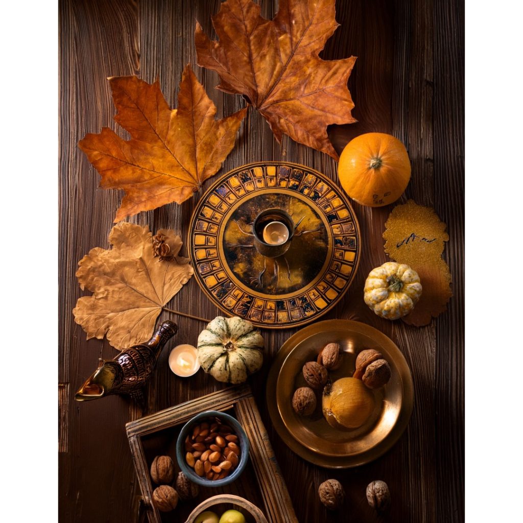 autumn image of leaves, pumpkins, and bowls from a bird's eye view