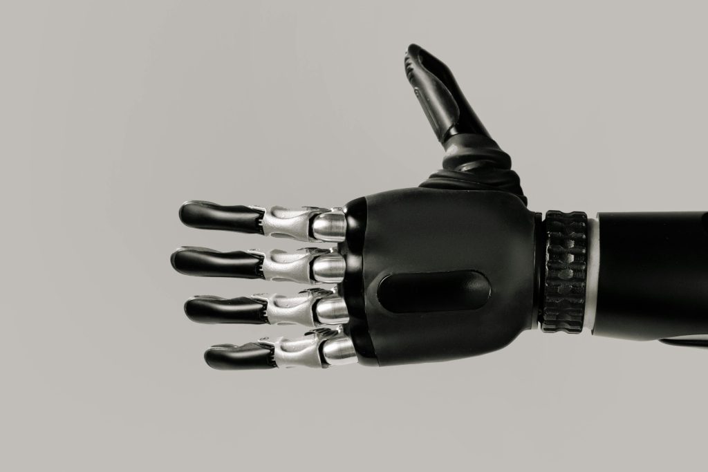 tech and touch shows a black robotic hand