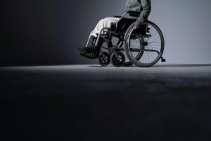 person in a manual wheelchair. The head of the person isn't showing.